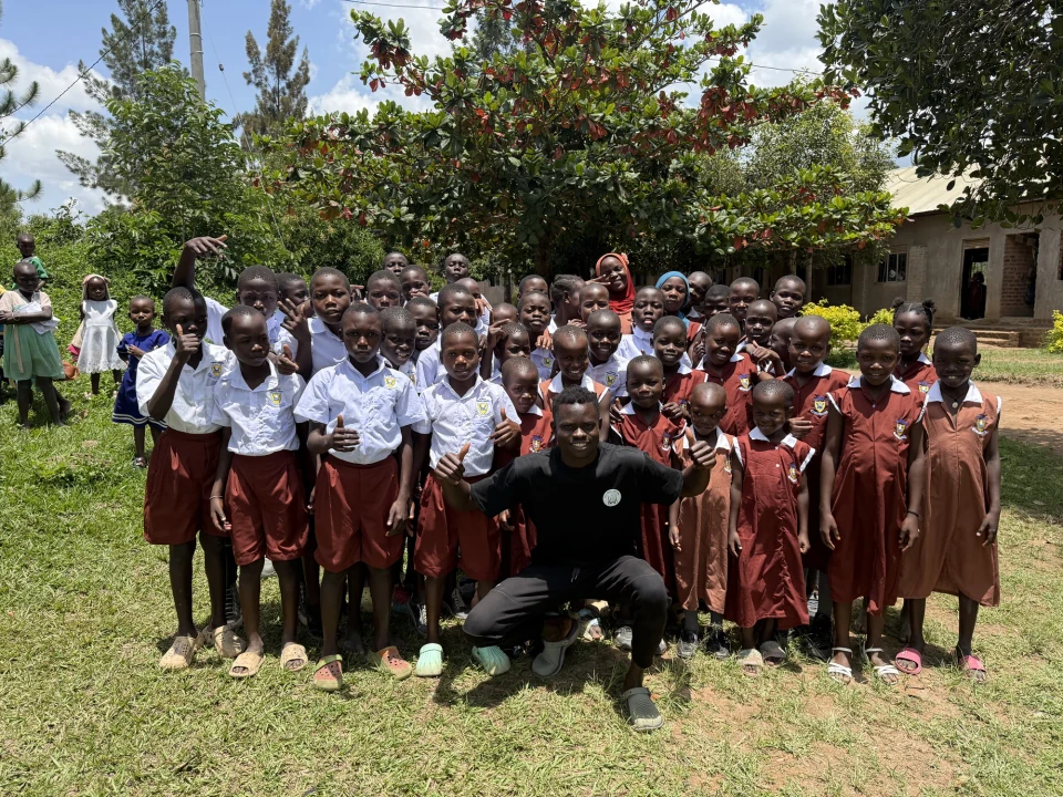 Clon Circus Uganda children and their coach together